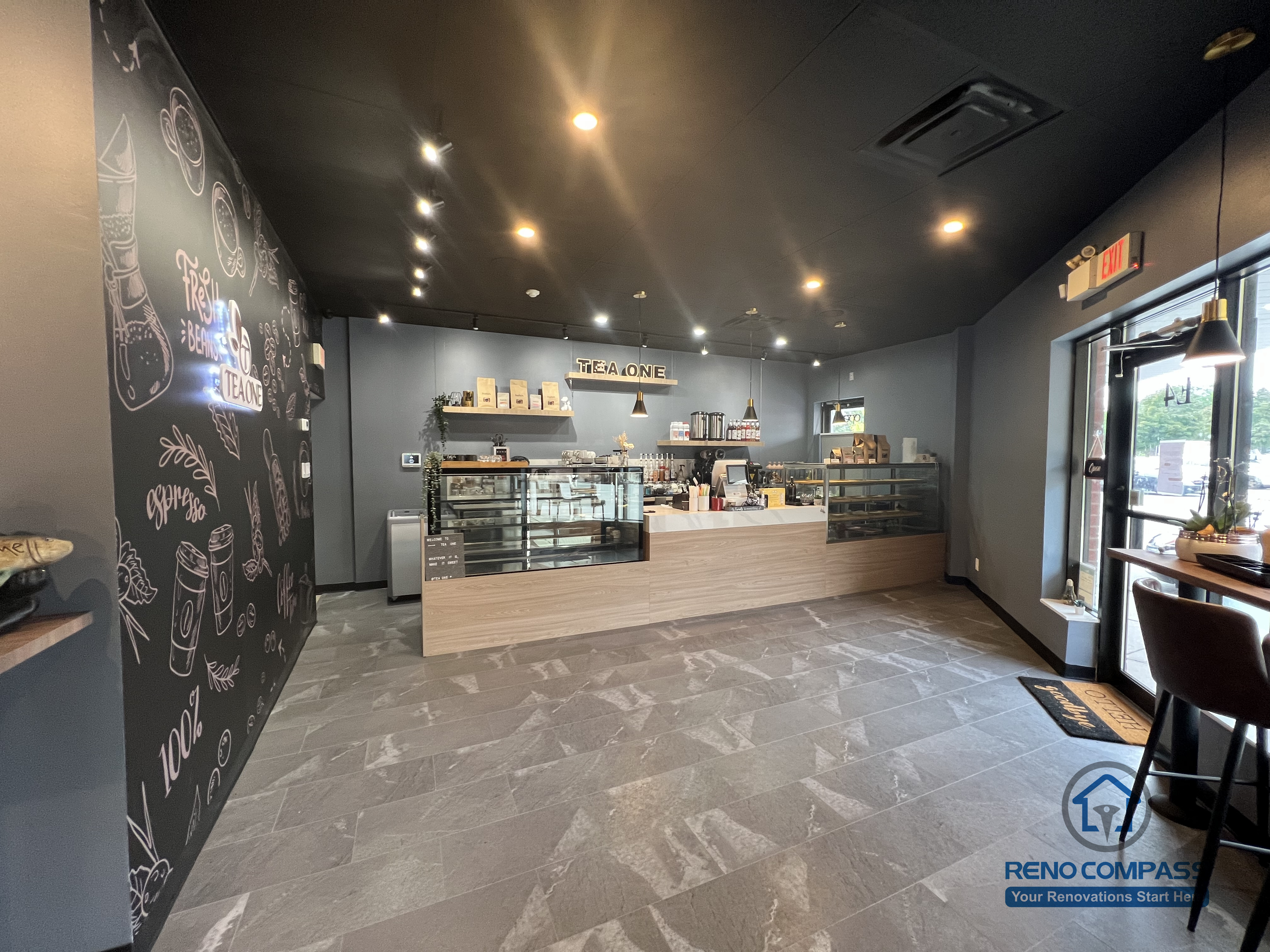 A completed Mississauga commercial renovation showcasing a restaurant front counter with custom finishes, durable flooring, and a streamlined service layout. Designed to support high-traffic operation while maintaining a clean and modern customer-facing space.