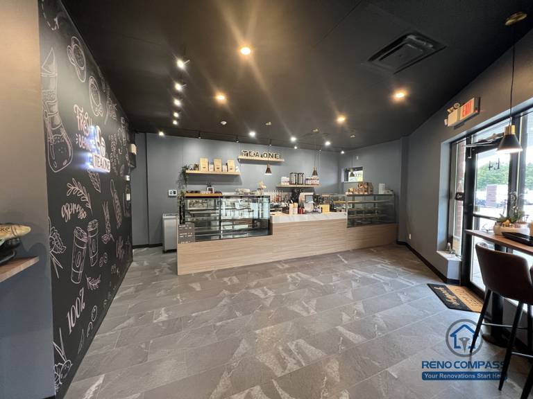 A completed Mississauga commercial renovation showcasing a restaurant front counter with custom finishes, durable flooring, and a streamlined service layout. Designed to support high-traffic operation while maintaining a clean and modern customer-facing space.