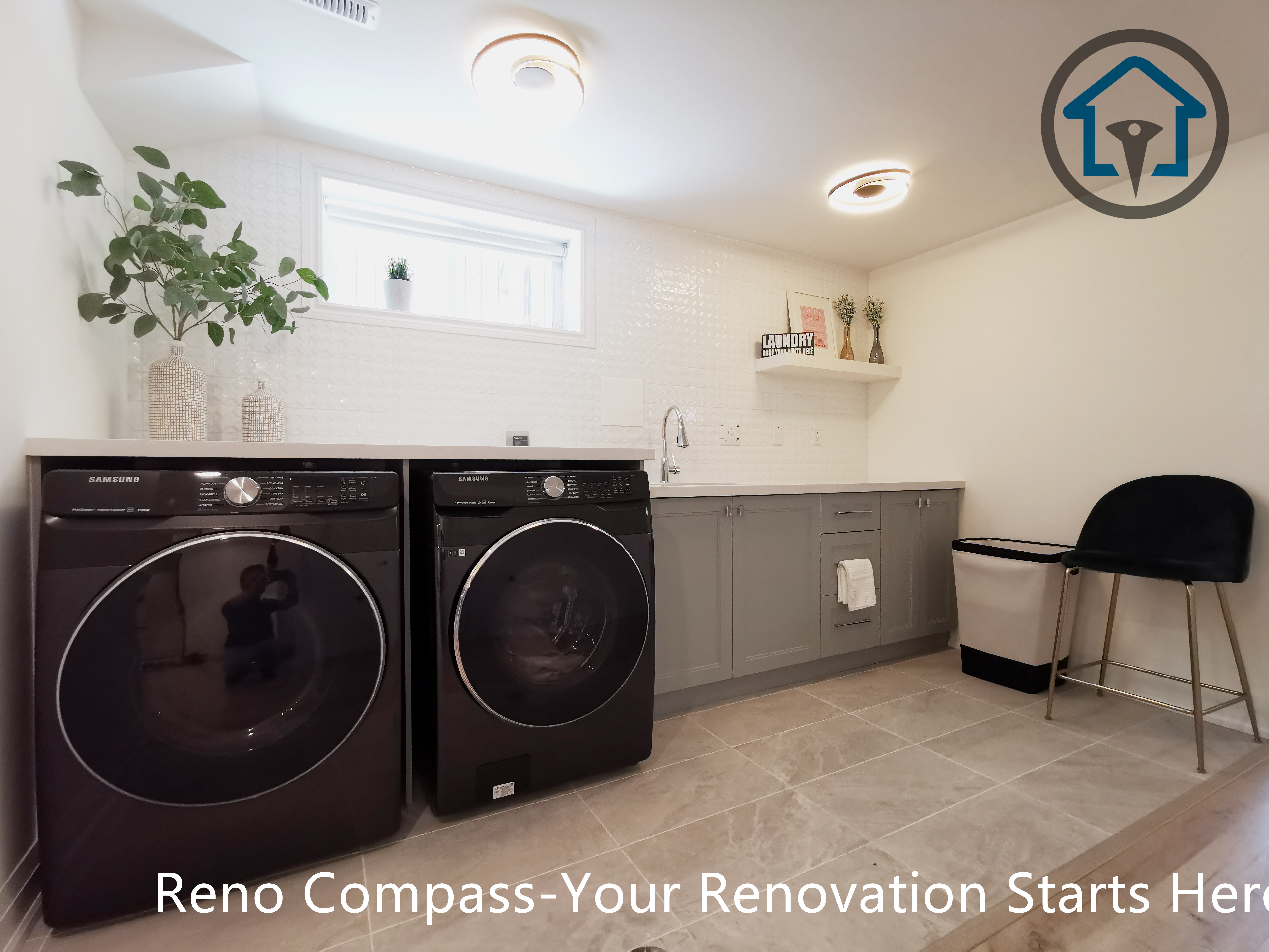 This North York basement renovation features a modern laundry room with built-in cabinetry, a quartz countertop, and a functional sink area. Front-load washer and dryer units are seamlessly integrated into the space, while soft lighting and neutral finishes create a clean and organized environment. Completed by a Toronto renovation company focused on practical layouts and long-term usability.