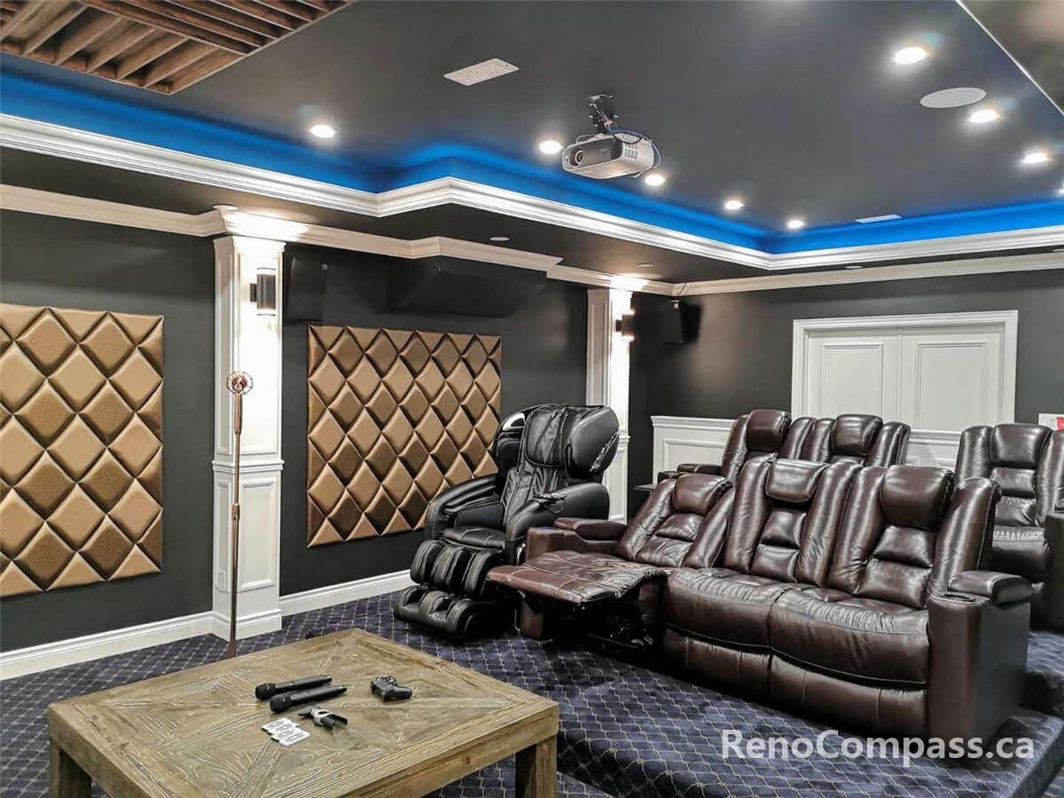 This image highlights the main seating area of a custom home theater, featuring tiered leather recliner seating, decorative acoustic wall panels, recessed ceiling lighting, and a balanced layout designed for immersive sound and viewing comfort.