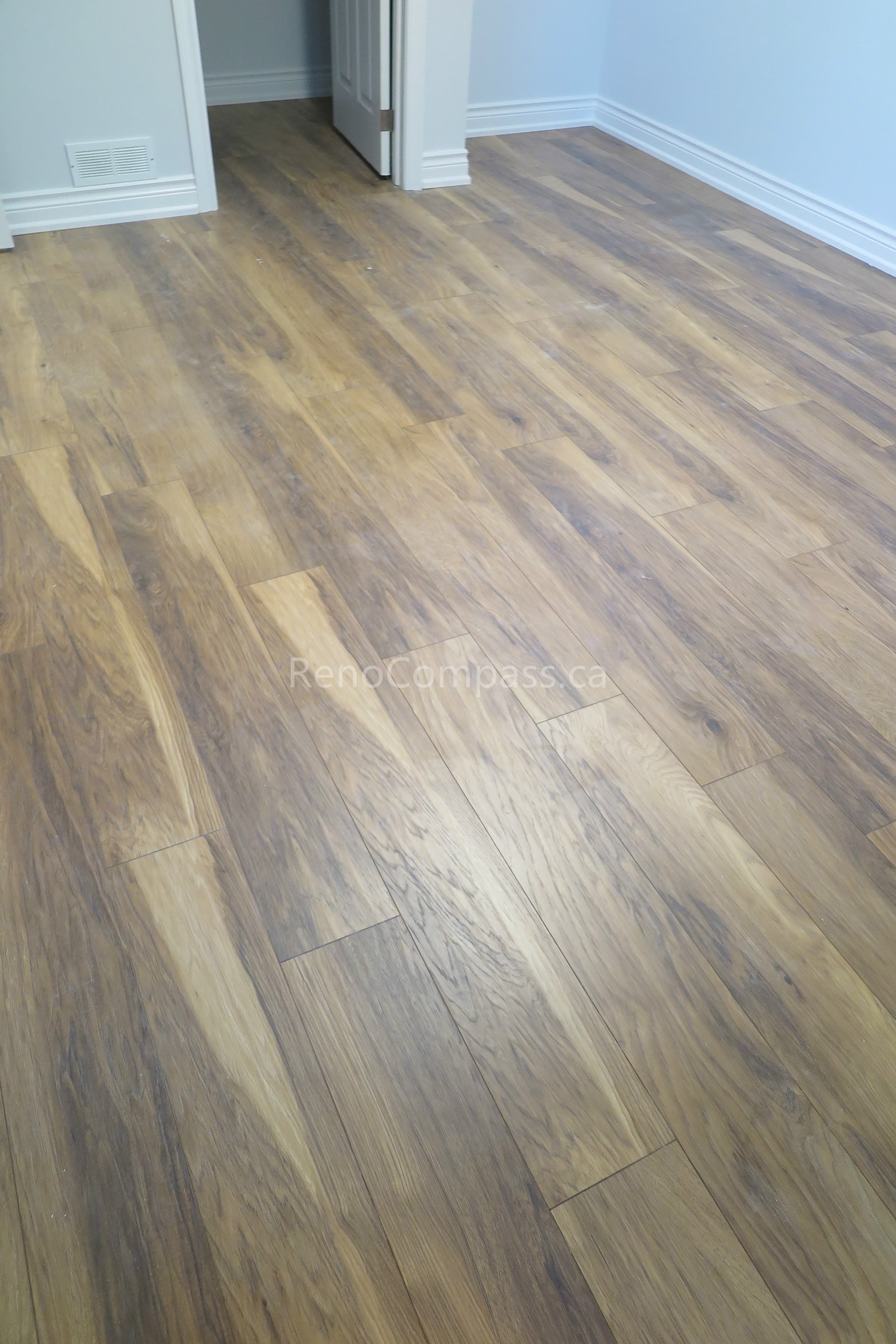 This North York interior renovation features newly installed engineered hardwood flooring that enhances warmth, durability, and overall visual continuity throughout the home. Completed by a professional Toronto renovation company, Reno Compass focuses on precise flooring alignment, clean baseboard finishing, and high-quality material selection to create a modern and comfortable living environment.