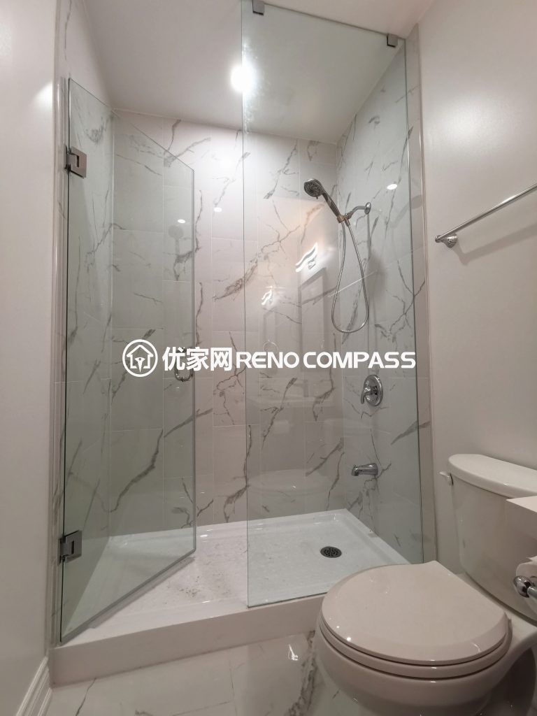 This Vaughan basement renovation highlights a modern bathroom upgrade featuring a frameless glass shower enclosure, marble-style wall tiles, and clean contemporary fixtures. The space is designed for durability, easy maintenance, and a bright modern look that complements the finished basement layout. Completed by an experienced Toronto renovation company, this bathroom renovation enhances comfort, functionality, and overall property value with high-quality craftsmanship and elegant design.