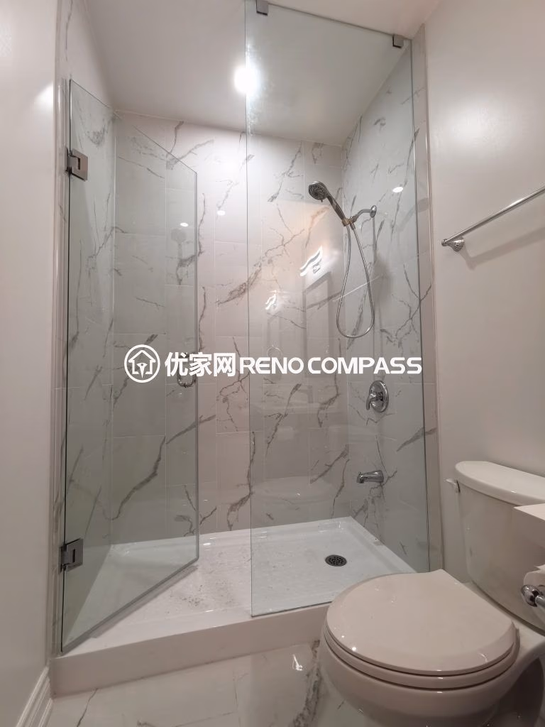 This Vaughan basement renovation highlights a modern bathroom upgrade featuring a frameless glass shower enclosure, marble-style wall tiles, and clean contemporary fixtures. The space is designed for durability, easy maintenance, and a bright modern look that complements the finished basement layout. Completed by an experienced Toronto renovation company, this bathroom renovation enhances comfort, functionality, and overall property value with high-quality craftsmanship and elegant design.