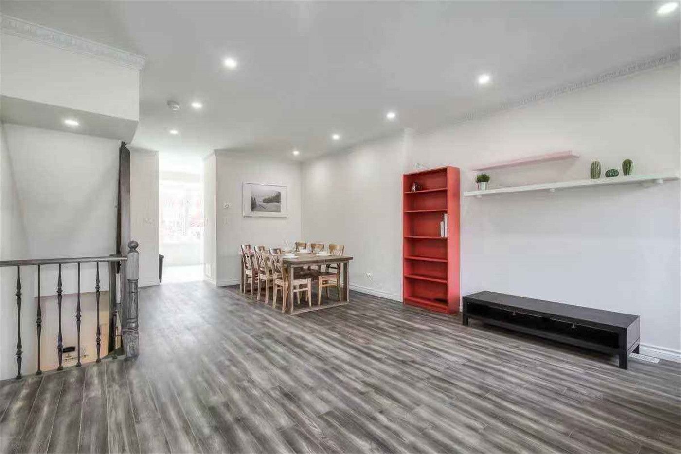 This Thornhill interior renovation features a spacious open-concept living and dining area with newly installed wood-style flooring, modern recessed lighting, and fresh neutral wall finishes. The upgraded staircase railings and clean layout enhance both functionality and visual appeal, creating a bright and welcoming home environment. Completed by a professional Toronto renovation team, this project highlights quality craftsmanship and modern interior transformation for comfortable family living.