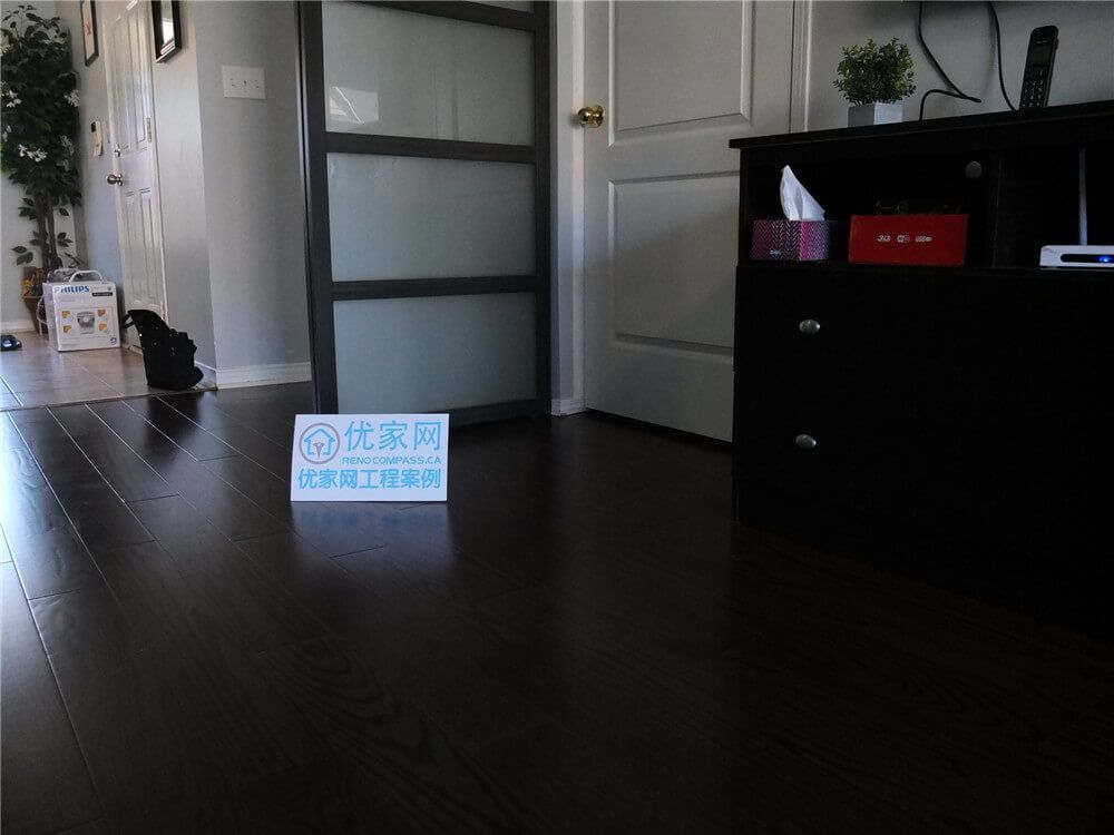 This image showcases the completed dark hardwood flooring installation in a Mississauga home renovation project. The rich wood tones and clean plank alignment create a modern and elegant interior atmosphere that enhances both durability and visual appeal. As a professional Toronto Renovation Company, Reno Compass specializes in high-quality flooring renovations designed to improve comfort, functionality, and long-term home value.