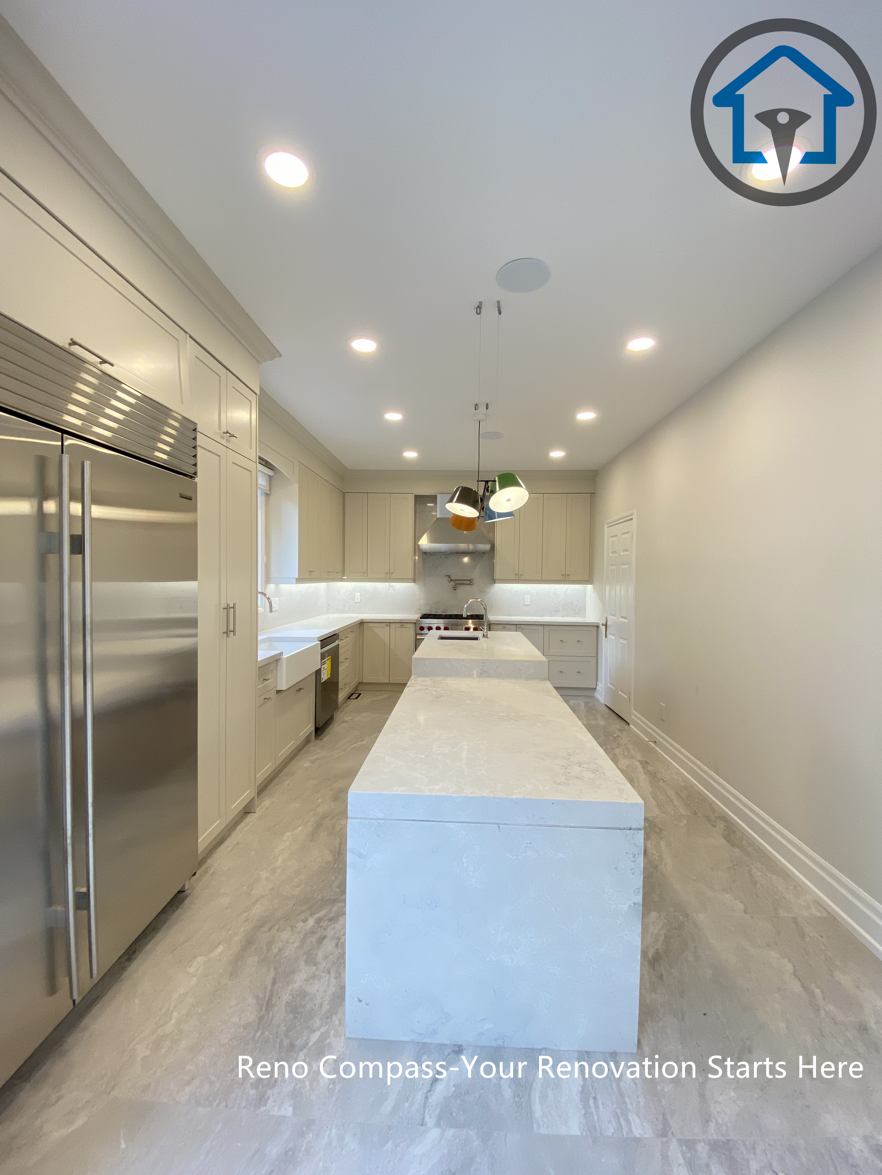 Custom kitchen with island sink, gas range, and tailored cabinetry, completed as part of a Thornhill renovation by Reno Compass.