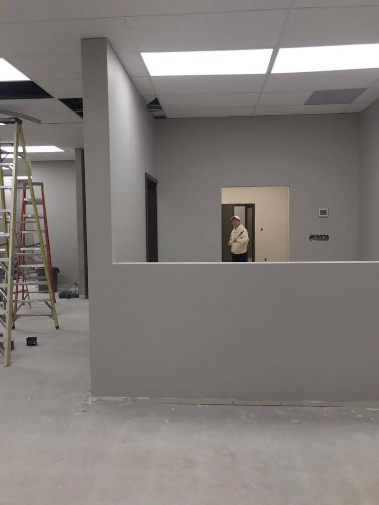 This Toronto commercial renovation project features newly constructed interior partitions designed to create a functional office layout with improved space planning and workflow efficiency. The build-out includes drywall installation, suspended ceiling grid adjustments, and updated lighting integration to deliver a clean and modern commercial interior. The neutral color palette enhances brightness and professionalism, making the space suitable for offices, clinics, or service-based businesses across the GTA.