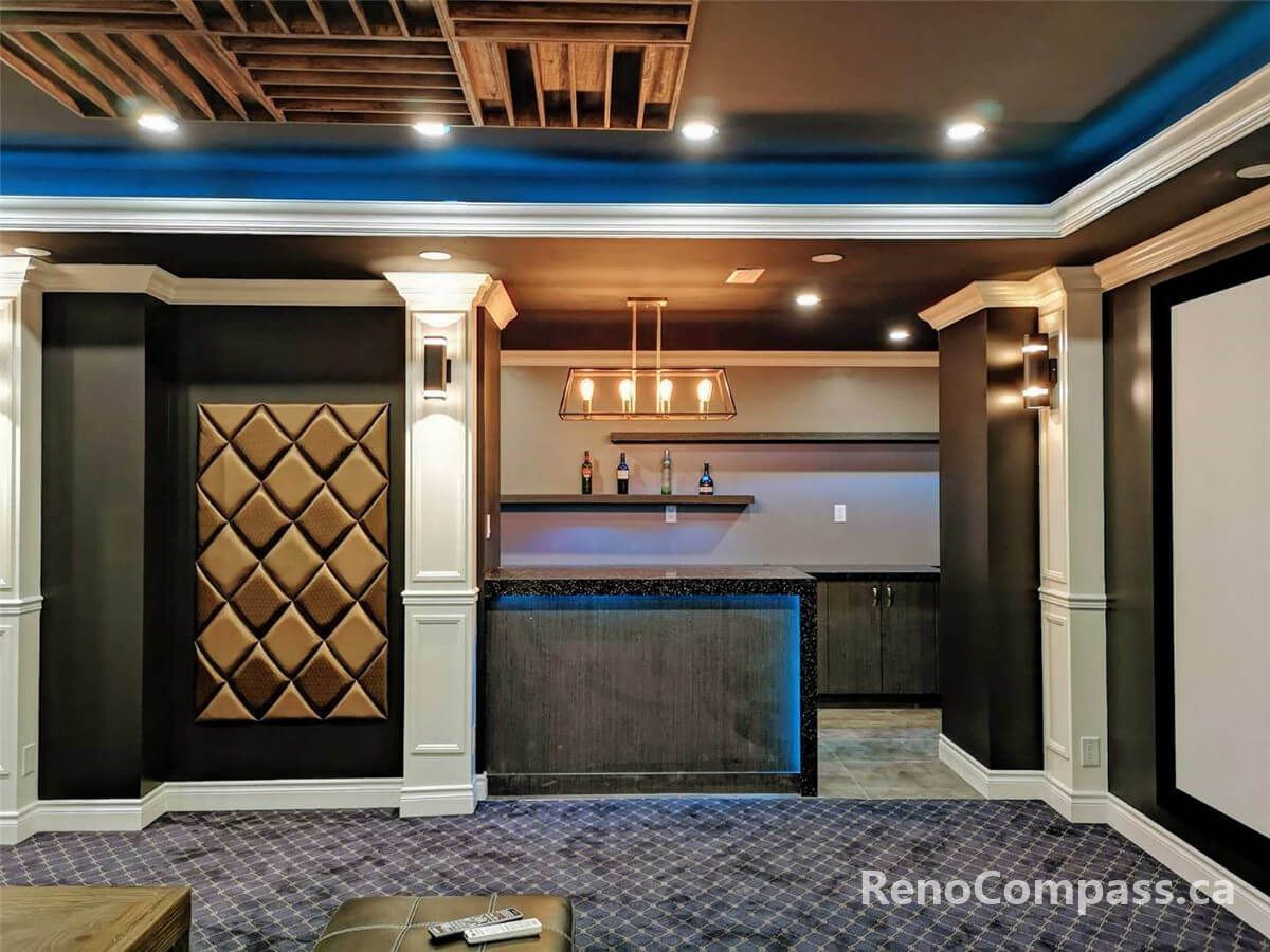 Professional home theatre installation in Mississauga featuring a custom bar area, decorative wall panels, integrated lighting, and luxury basement finishing. This modern entertainment space combines premium craftsmanship, acoustic-friendly design, and stylish interior details to create the perfect private cinema and lounge environment for homeowners.