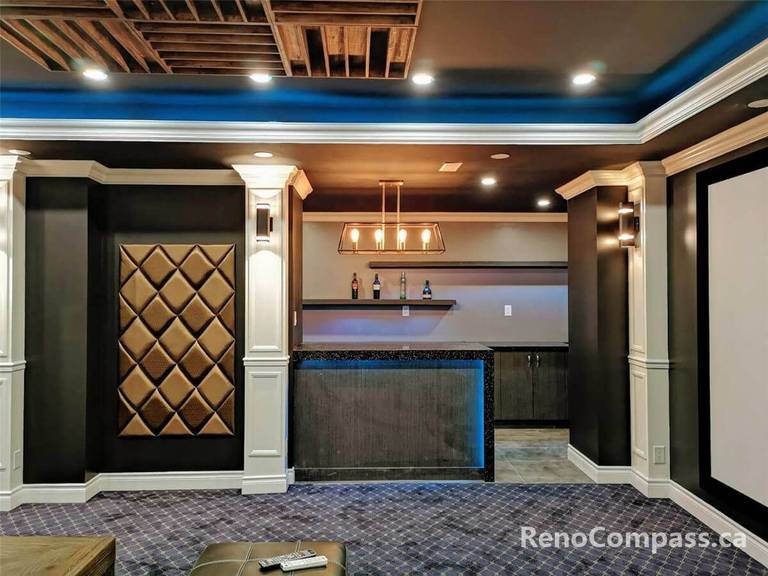Professional home theatre installation in Mississauga featuring a custom bar area, decorative wall panels, integrated lighting, and luxury basement finishing. This modern entertainment space combines premium craftsmanship, acoustic-friendly design, and stylish interior details to create the perfect private cinema and lounge environment for homeowners.