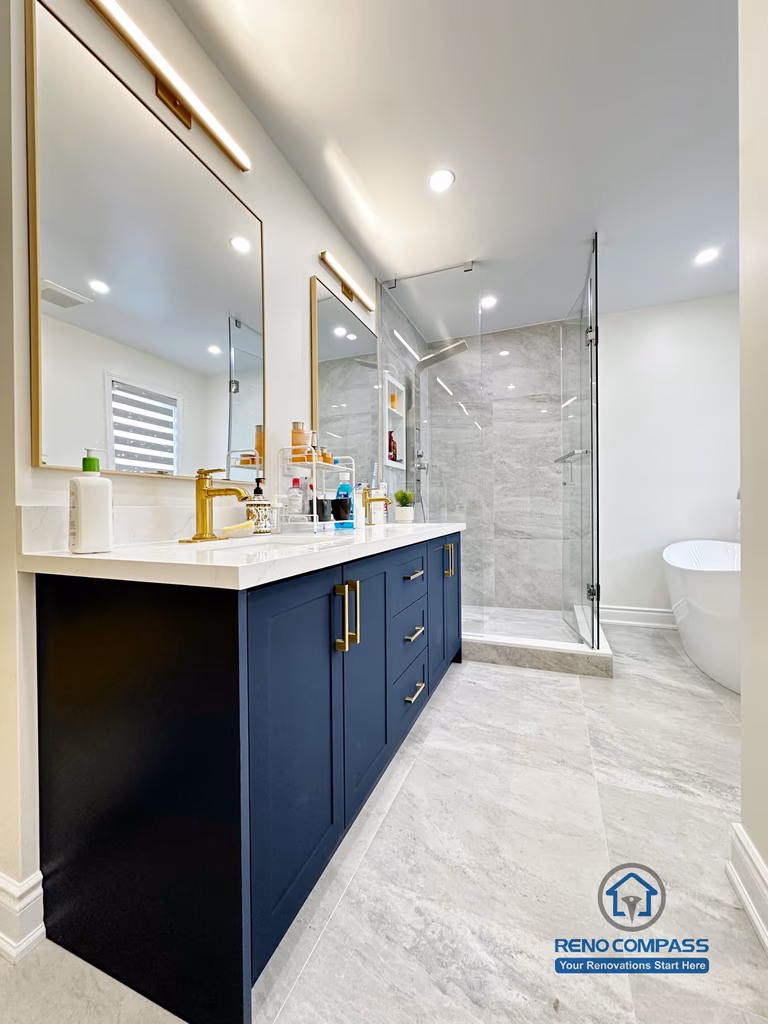 Master bathroom renovation in Markham featuring a frameless glass shower, large-format tile finishes, a custom vanity with matte black cabinetry, and brass fixtures. The design combines clean lines, efficient layout, and a refined modern aesthetic for everyday comfort.