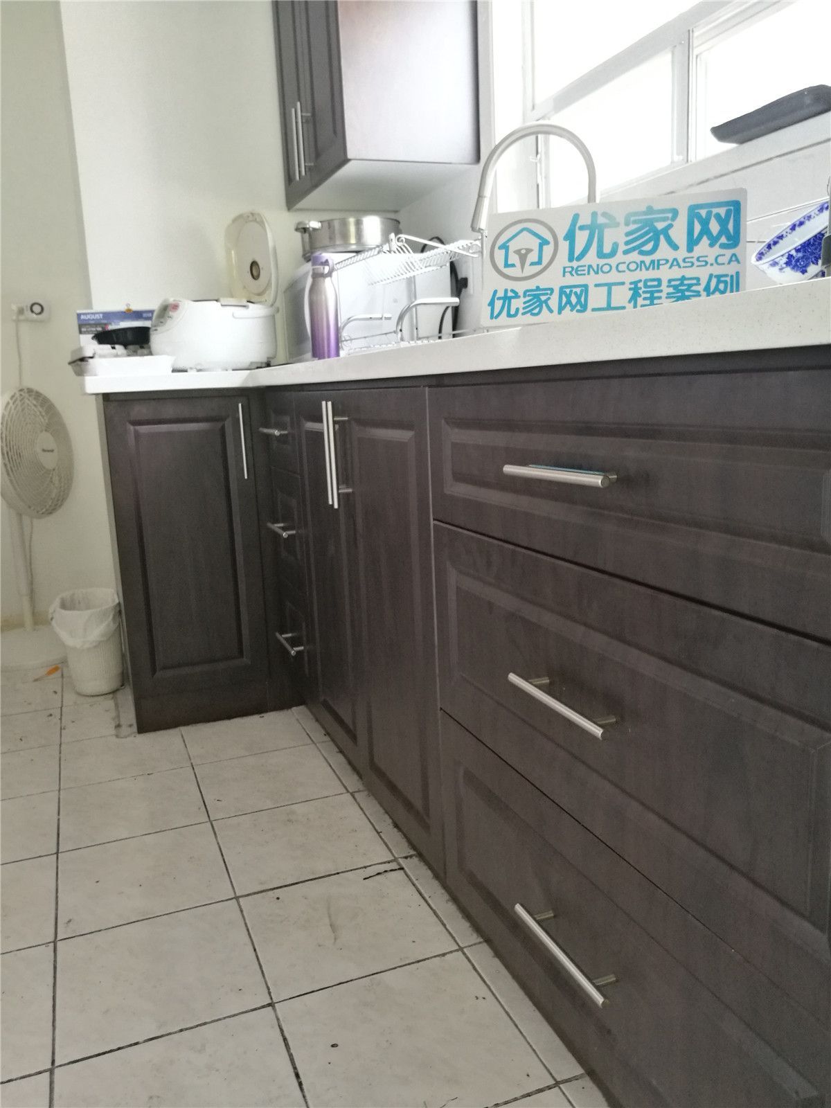 Completed kitchen renovation in Richmond Hill showcasing sleek cabinetry, marble-inspired backsplash, and elegant lighting, crafted by Toronto renovation company Reno Compass Inc.